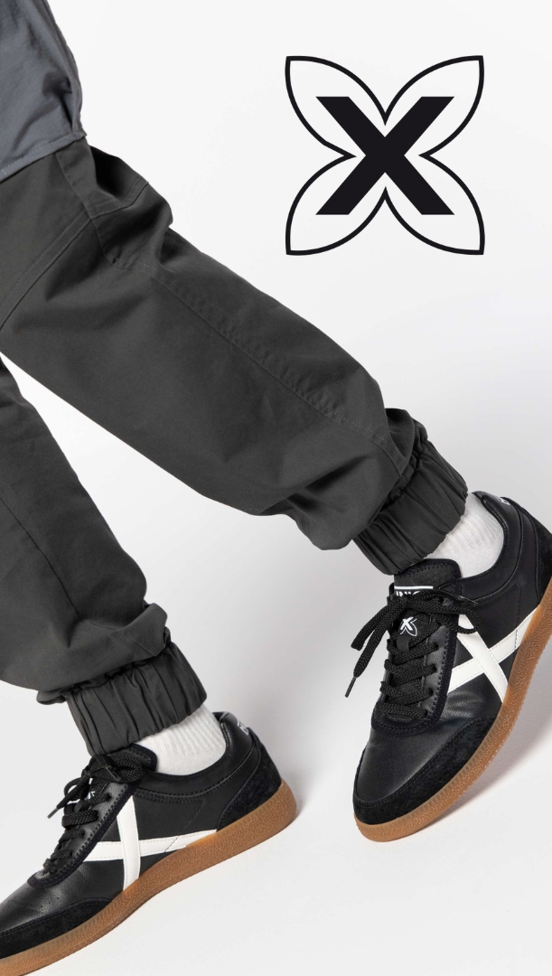 Zapatillas Munich negras con logo en blanco y suela de goma, estilo urbano para hombre